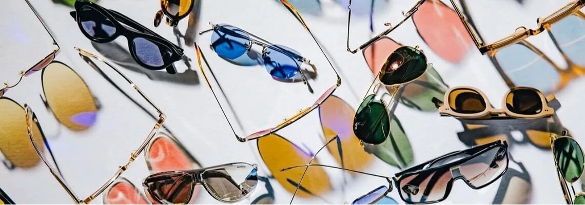 Branded polarized sunglasses on a light background